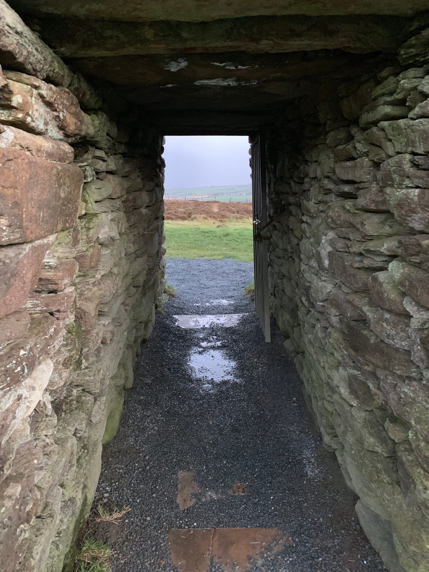 Looking out through the stone entrance passage of Grianán of Aileach to the Donegal countryside
